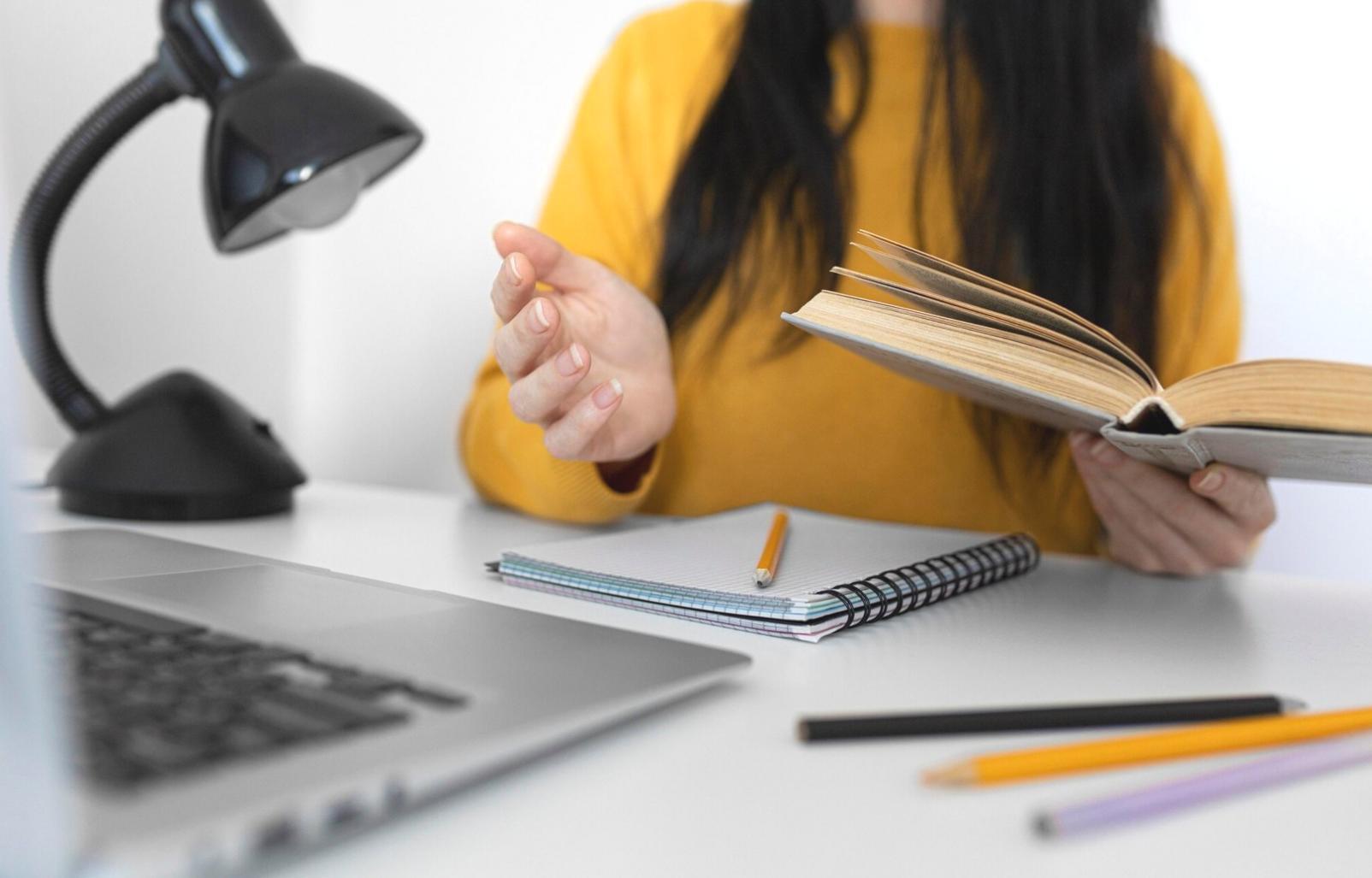 Professional consultation workspace showing expense tracking tools and financial planning materials
